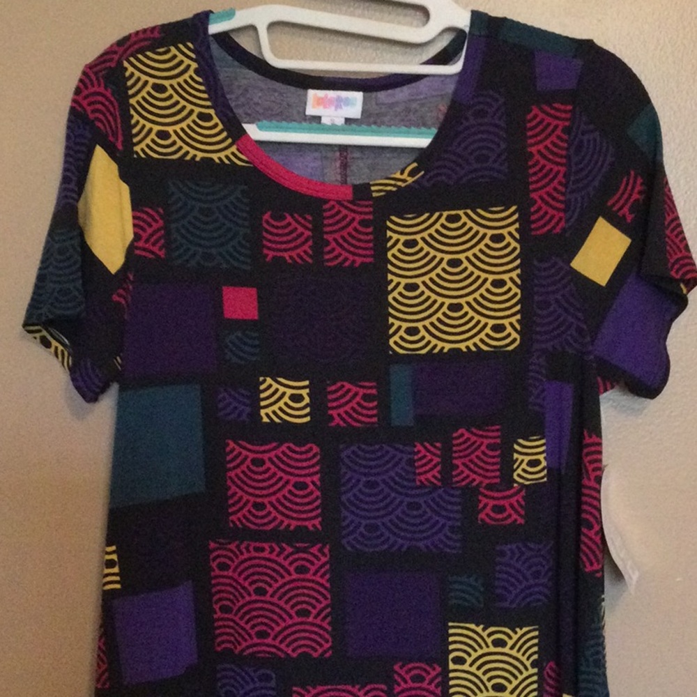 New with tags Lularoe Carly Dress, size Small. Geometric pattern in pink, yellow